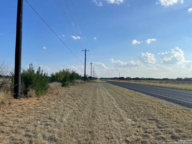a view of an ocean & fence