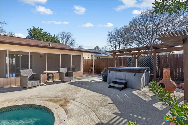 a house view with a sitting space and garden space