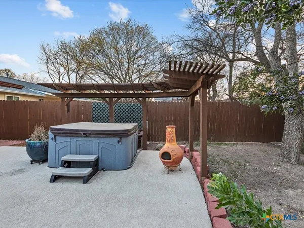 a view of patio with table and chairs