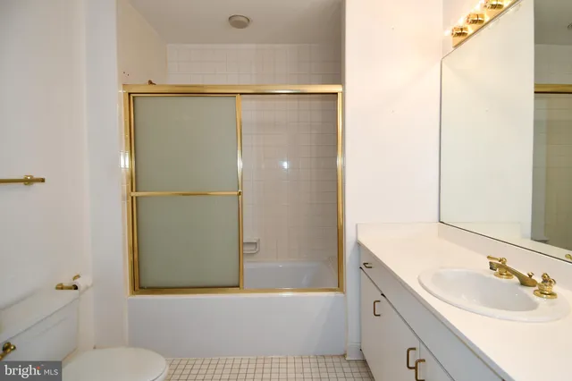a bathroom with a double vanity sink and mirror