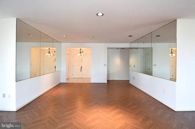a view of an entryway with wooden floor