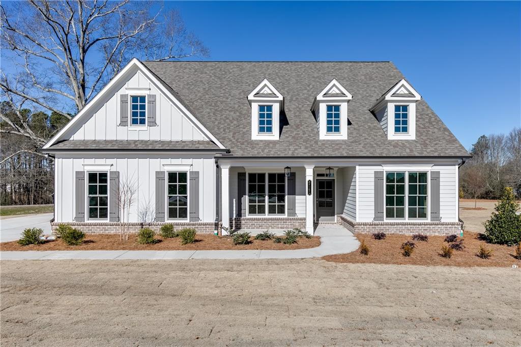 6145 Namon Wallace Road Cumming, GA 30028 - Photo 1 of 1 a front view of a house with a yard