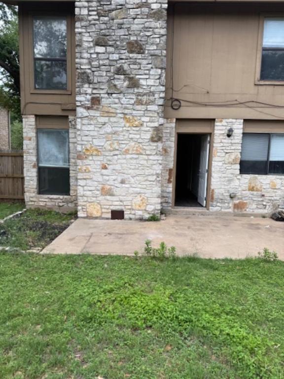 8333 Fathom Circle, Unit B Austin, TX 78750 - Photo 21 of 21 Entrance to property with stone siding and a patio