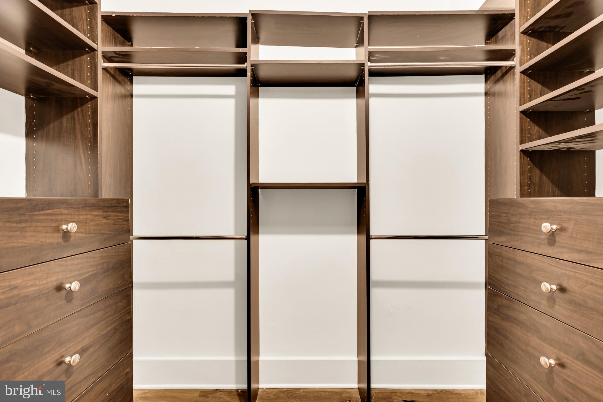1910 Kalorama Road Northwest, Unit 302 Washington, DC 20009 - Photo 21 of 28 a view of walk in closet with empty racks