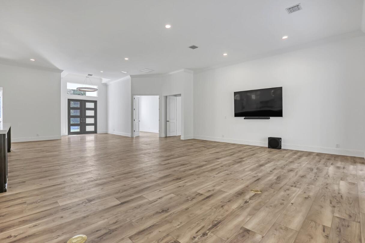 11871 Randolph Siding Road Jupiter, FL 33478 - Photo 17 of 51 a view of a livingroom with a flat screen tv