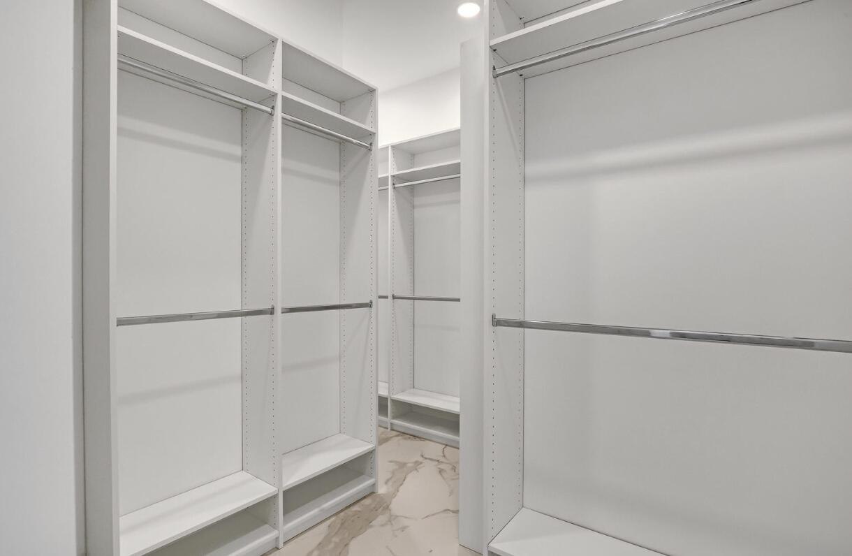 11871 Randolph Siding Road Jupiter, FL 33478 - Photo 36 of 51 a view of walk in closet with empty racks
