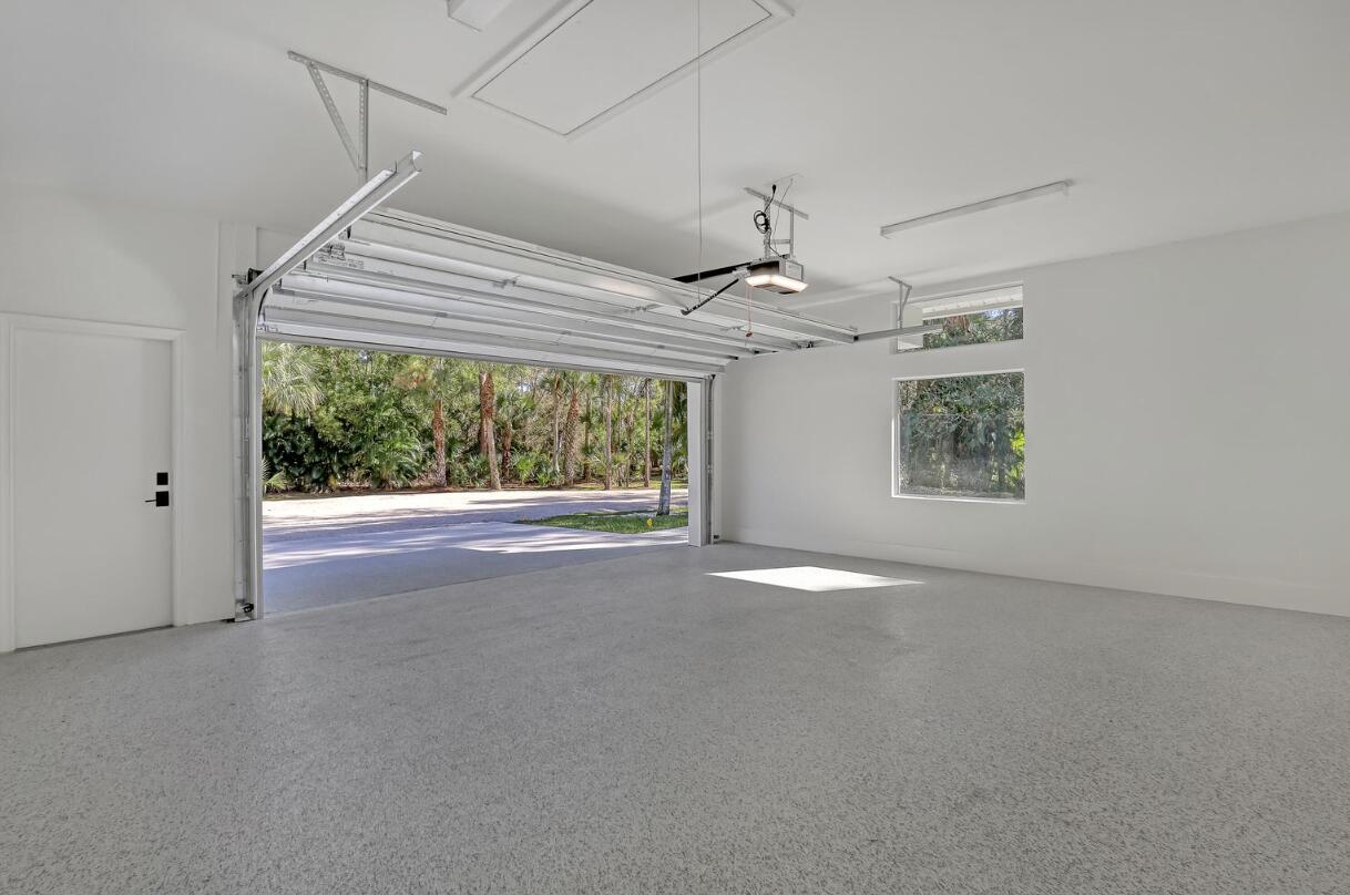 11871 Randolph Siding Road Jupiter, FL 33478 - Photo 48 of 51 a view of a room with a ceiling fan and window