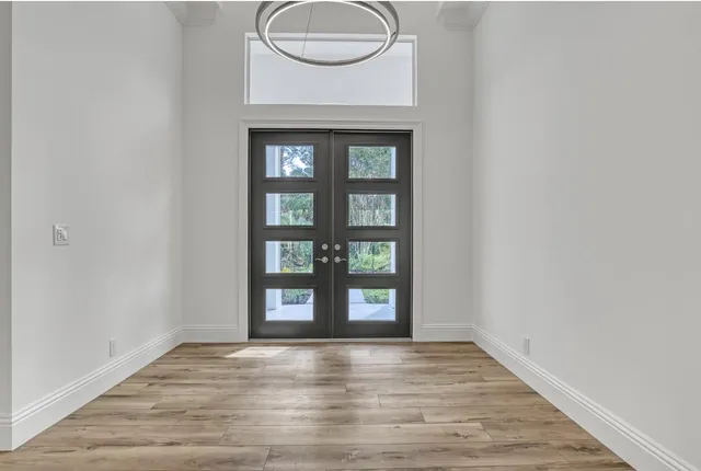 a view of a dining room with furniture and window
