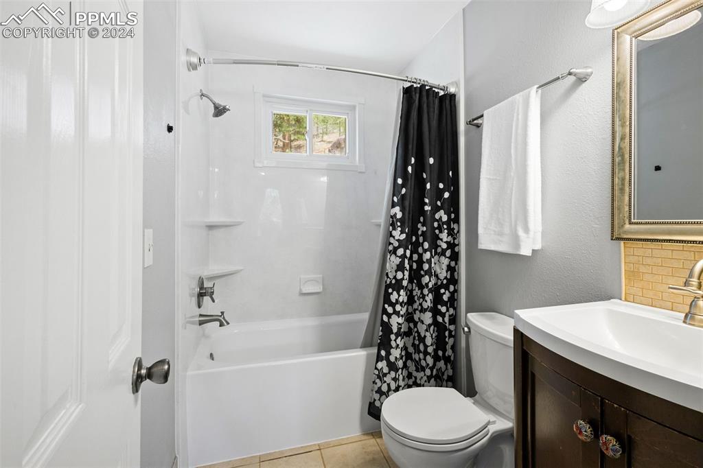 8228 Highway 24 Cascade, CO 80809 - Photo 13 of 34 a bathroom with a sink a toilet and shower