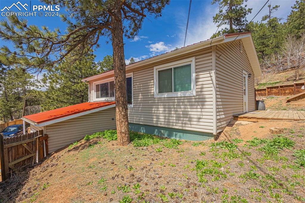 8228 Highway 24 Cascade, CO 80809 - Photo 18 of 34 a backyard of a house with lots of green space