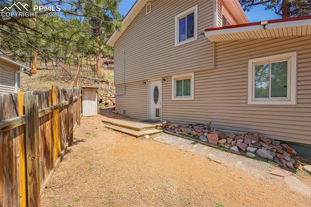 8228 Highway 24 Cascade, CO 80809 - Photo 20 of 34 a view of a backyard with wooden fence