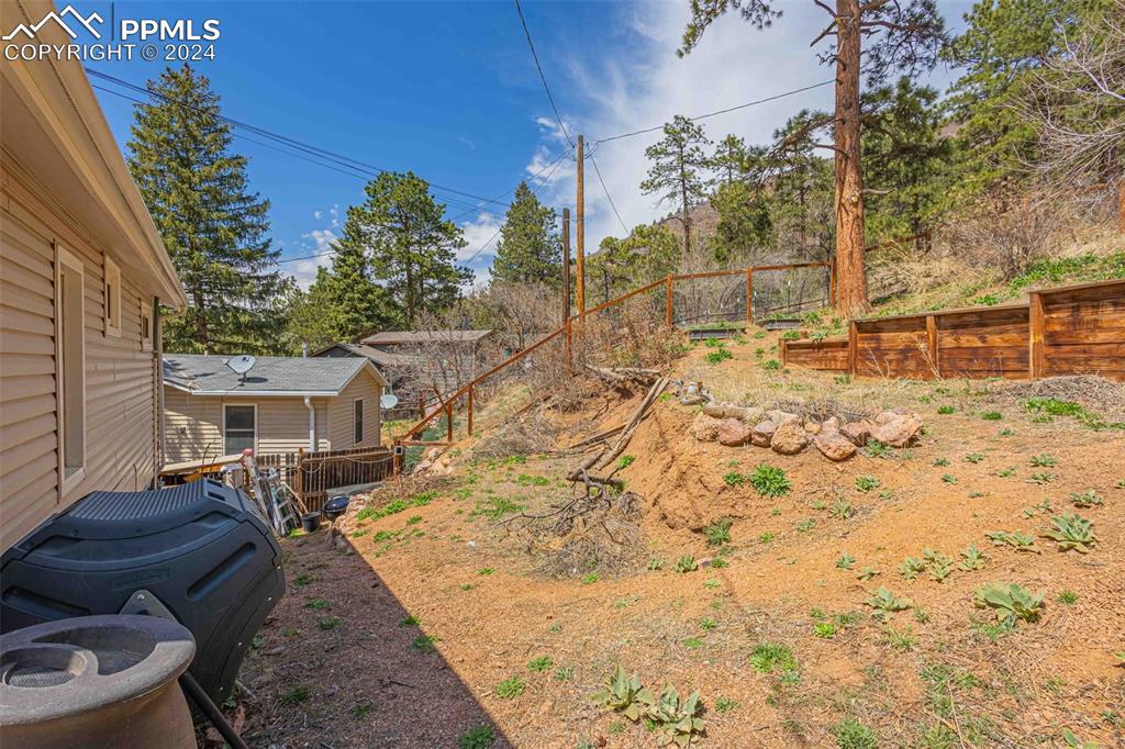 8228 Highway 24 Cascade, CO 80809 - Photo 21 of 34 a view of a house with a yard