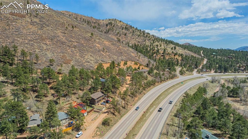 8228 Highway 24 Cascade, CO 80809 - Photo 32 of 34 a view of a forest with a mountain