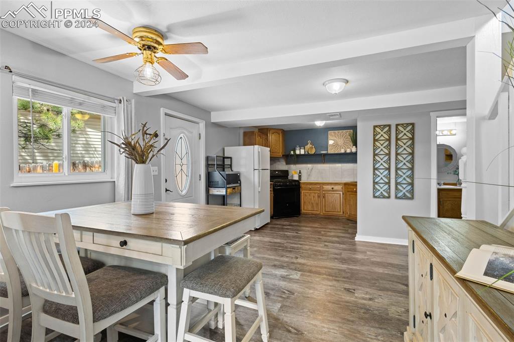 8228 Highway 24 Cascade, CO 80809 - Photo 6 of 34 a kitchen with a table and chairs