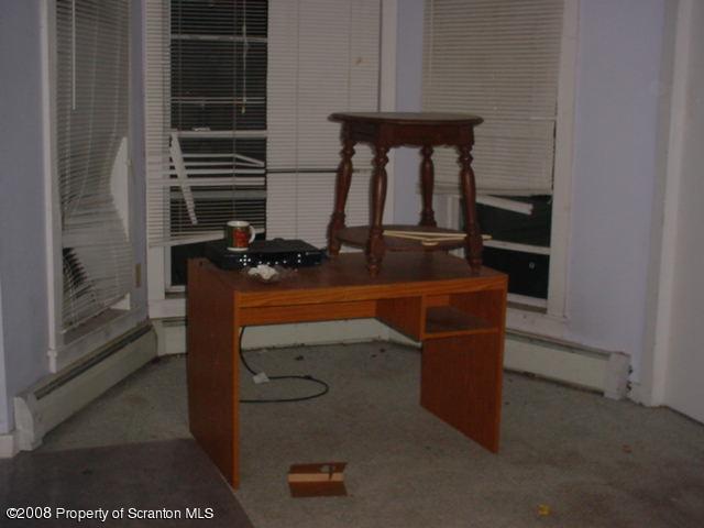 Fairview Street Meshoppen, PA 18630 - Photo 6 of 7 a room with a table and potted plant