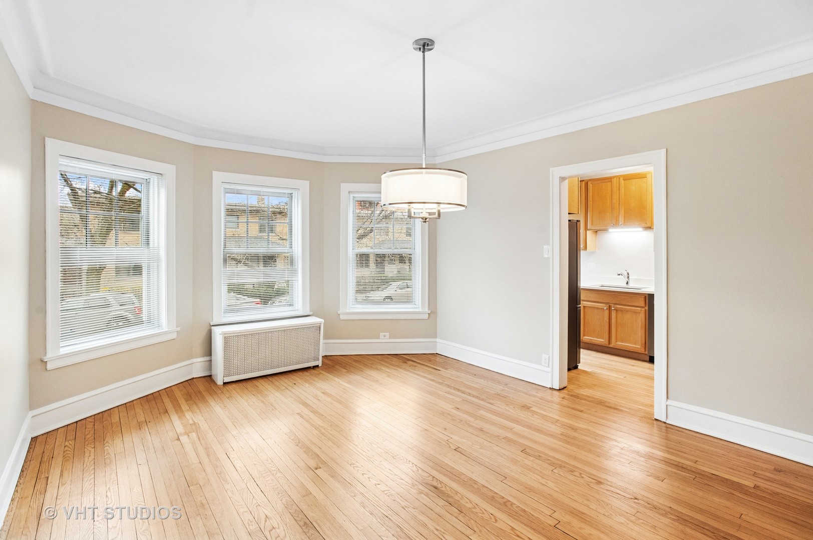 550 West Brompton Avenue, Unit 1S Chicago, IL 60657 - Photo 11 of 28 a view of an empty room with wooden floor and a window
