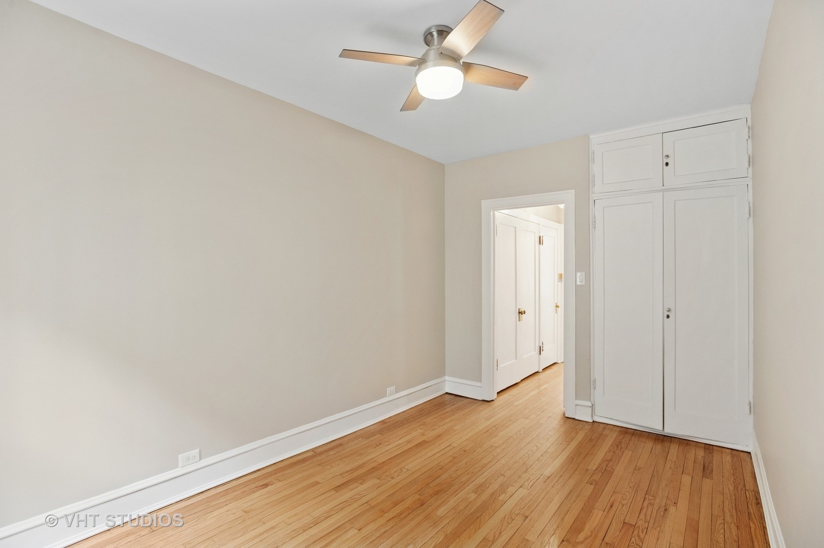 550 West Brompton Avenue, Unit 1S Chicago, IL 60657 - Photo 16 of 28 wooden floor in an empty room