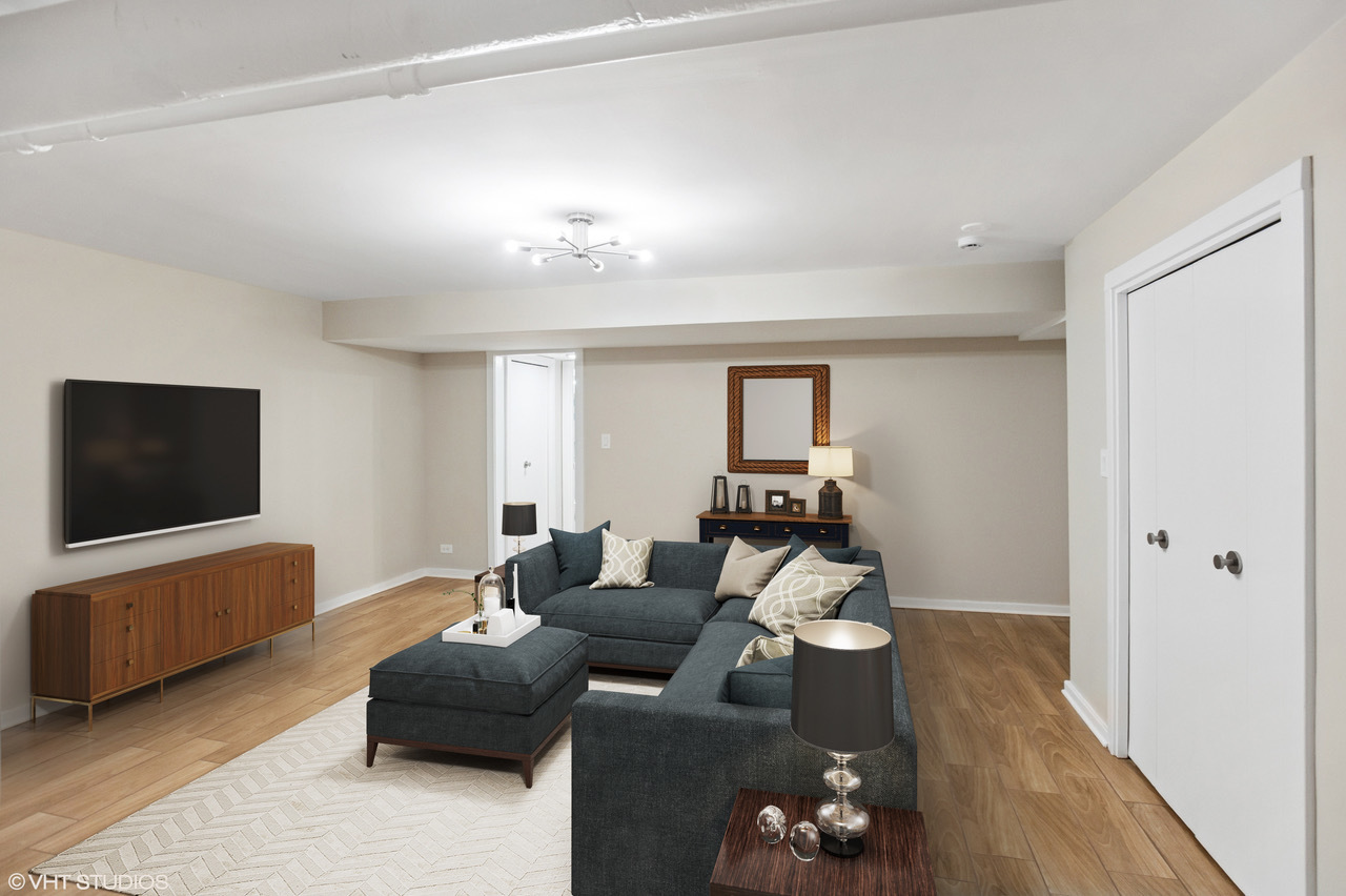 550 West Brompton Avenue, Unit 1S Chicago, IL 60657 - Photo 19 of 28 a living room with furniture and a flat screen tv