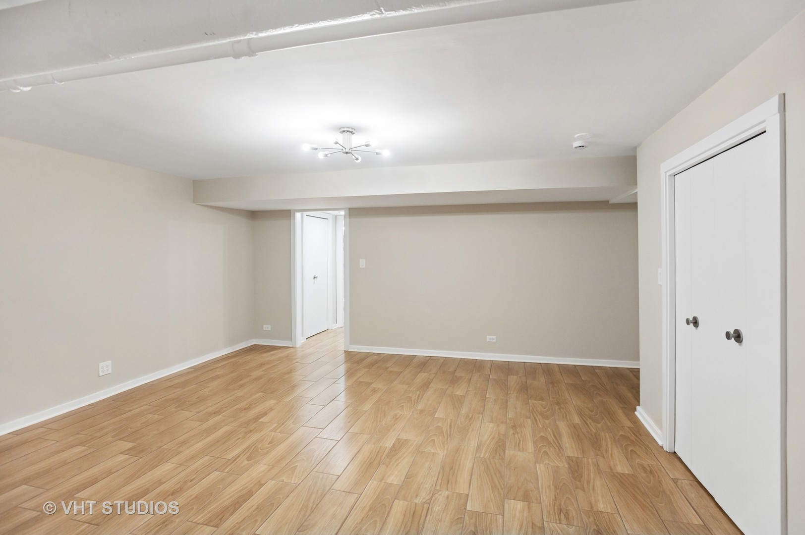 550 West Brompton Avenue, Unit 1S Chicago, IL 60657 - Photo 20 of 28 a view of an empty room with wooden floor