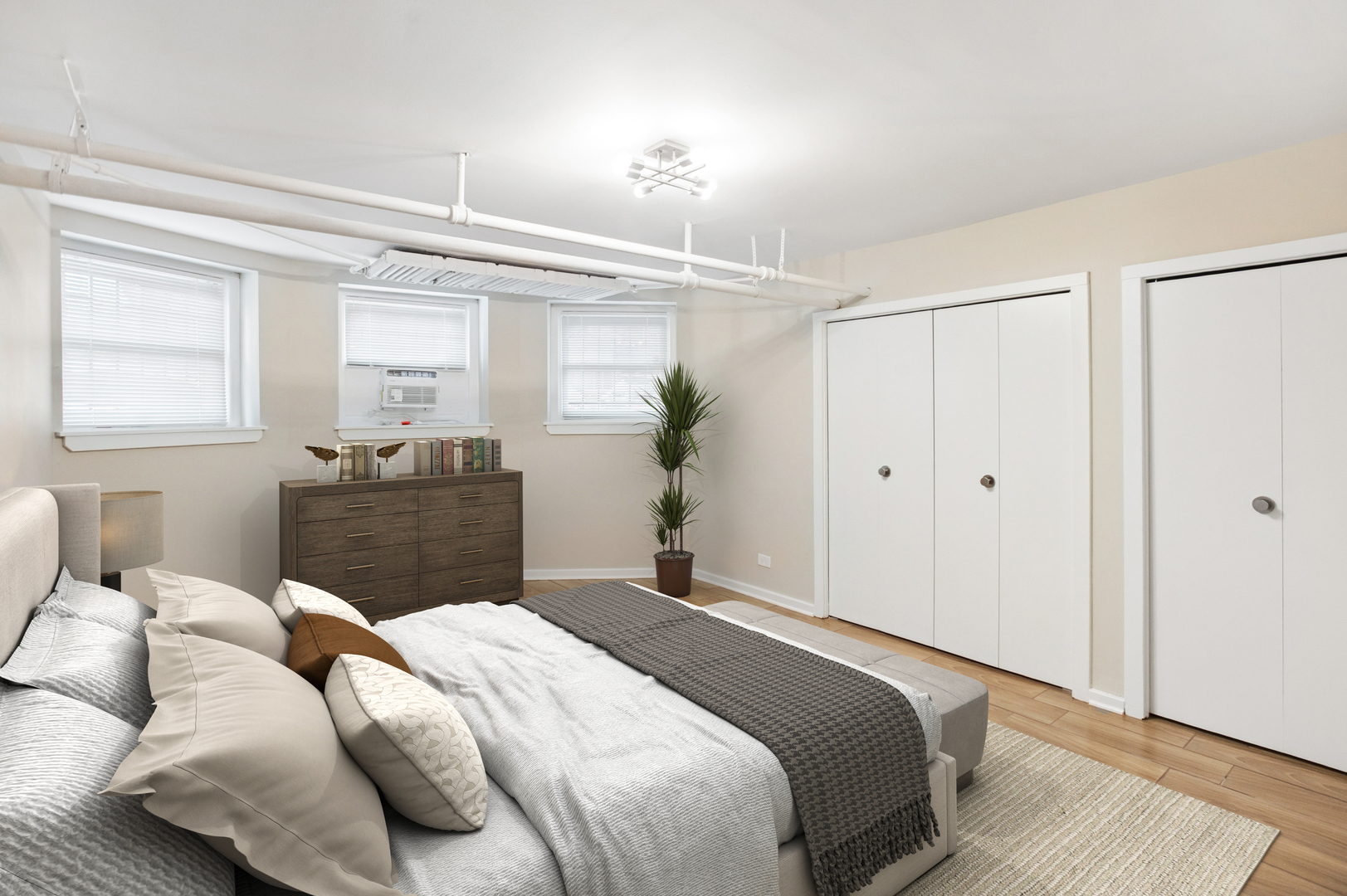 550 West Brompton Avenue, Unit 1S Chicago, IL 60657 - Photo 22 of 28 a bedroom with a bed and wooden floor