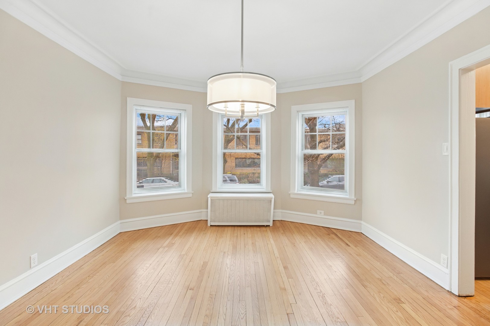 550 West Brompton Avenue, Unit 1S Chicago, IL 60657 - Photo 9 of 28 a view of livingroom with furniture wooden floor and windows