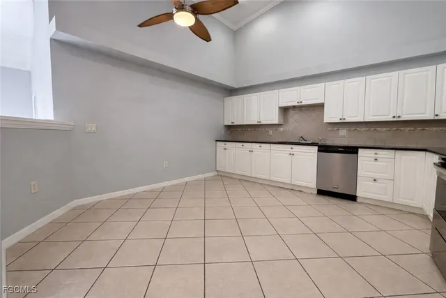 a kitchen with stainless steel appliances a sink and cabinets