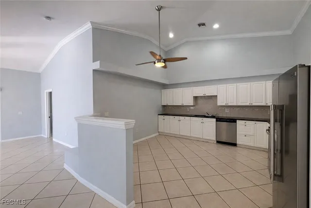 a kitchen with a cabinets and window