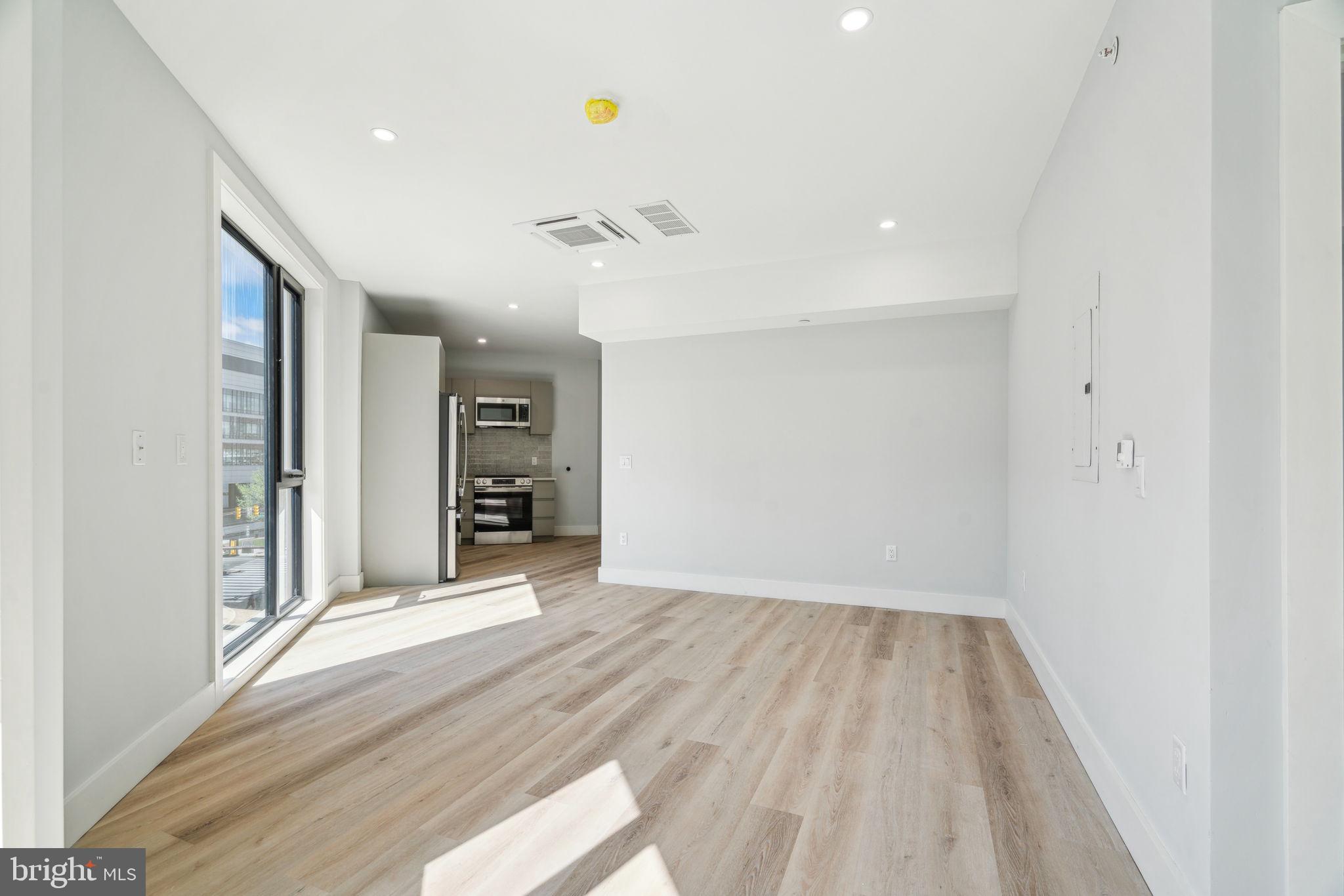 3748-9 Lancaster Avenue, Unit 211 Philadelphia, PA 19104 - Photo 15 of 29 a view of an empty room with a window