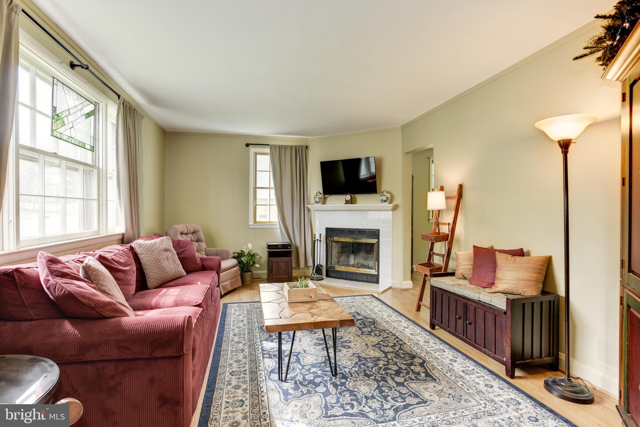 1306 Charmuth Road Lutherville-Timonium, MD 21093 - Photo 8 of 47 Spacious living room with hardwoods, fireplace