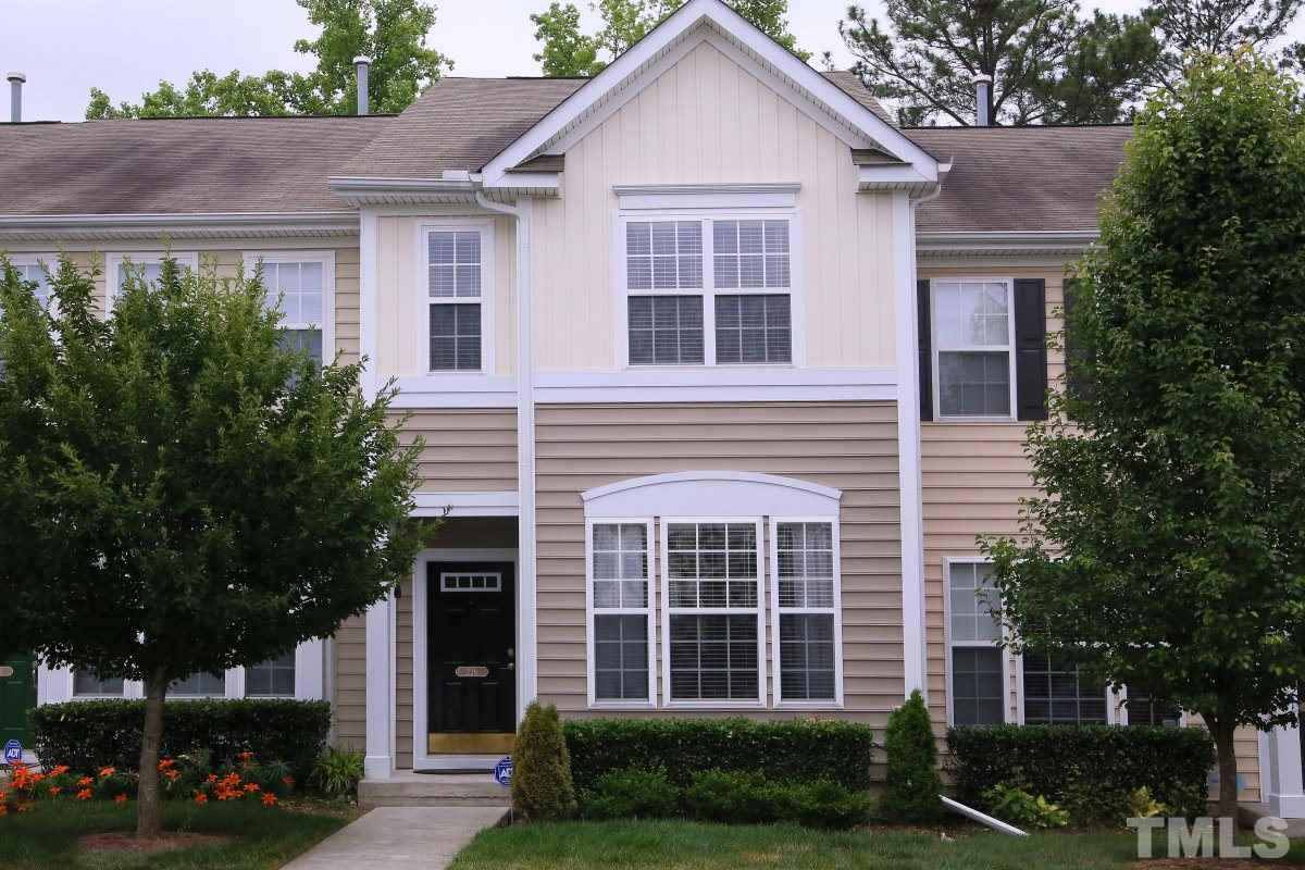 226 Cedar Elm Road Durham, NC 27713 - Photo 1 of 25 a view of a brick house with plants and large trees