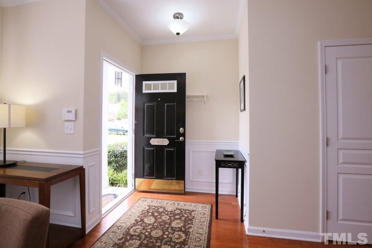 226 Cedar Elm Road Durham, NC 27713 - Photo 2 of 25 a view of an entryway with wooden floor