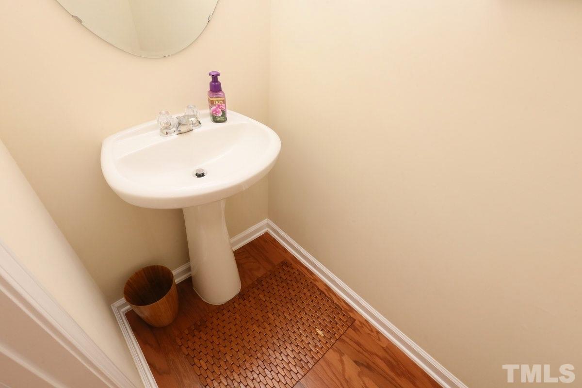 226 Cedar Elm Road Durham, NC 27713 - Photo 13 of 25 a bathroom with a sink and mirror