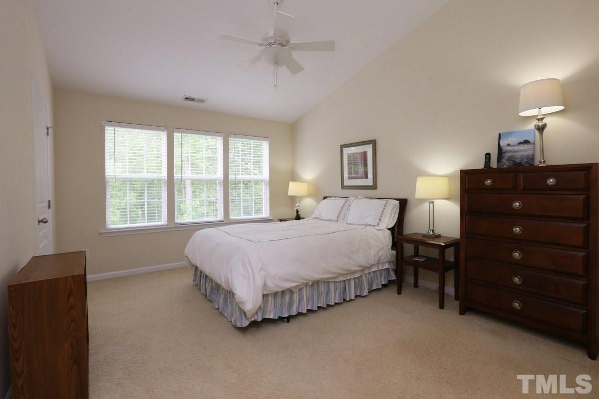 226 Cedar Elm Road Durham, NC 27713 - Photo 14 of 25 a bedroom with a bed and a closet