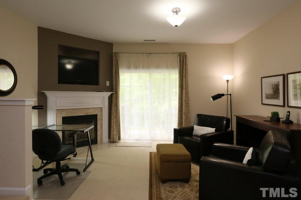 226 Cedar Elm Road Durham, NC 27713 - Photo 18 of 25 a living room with furniture and a fireplace