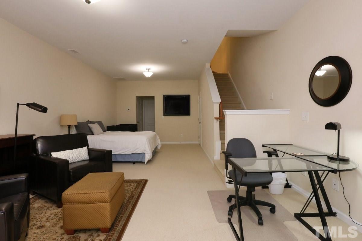 226 Cedar Elm Road Durham, NC 27713 - Photo 19 of 25 a work room with furniture and a mirror