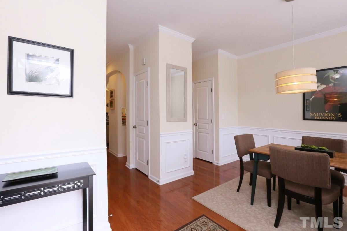 226 Cedar Elm Road Durham, NC 27713 - Photo 3 of 25 a view of a dining room with furniture and wooden floor