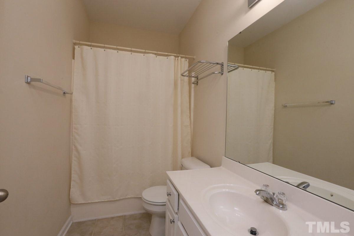 226 Cedar Elm Road Durham, NC 27713 - Photo 21 of 25 a bathroom with a sink and toilet