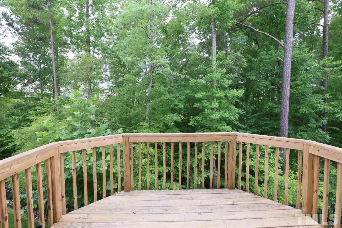 226 Cedar Elm Road Durham, NC 27713 - Photo 22 of 25 a view of a wooden deck