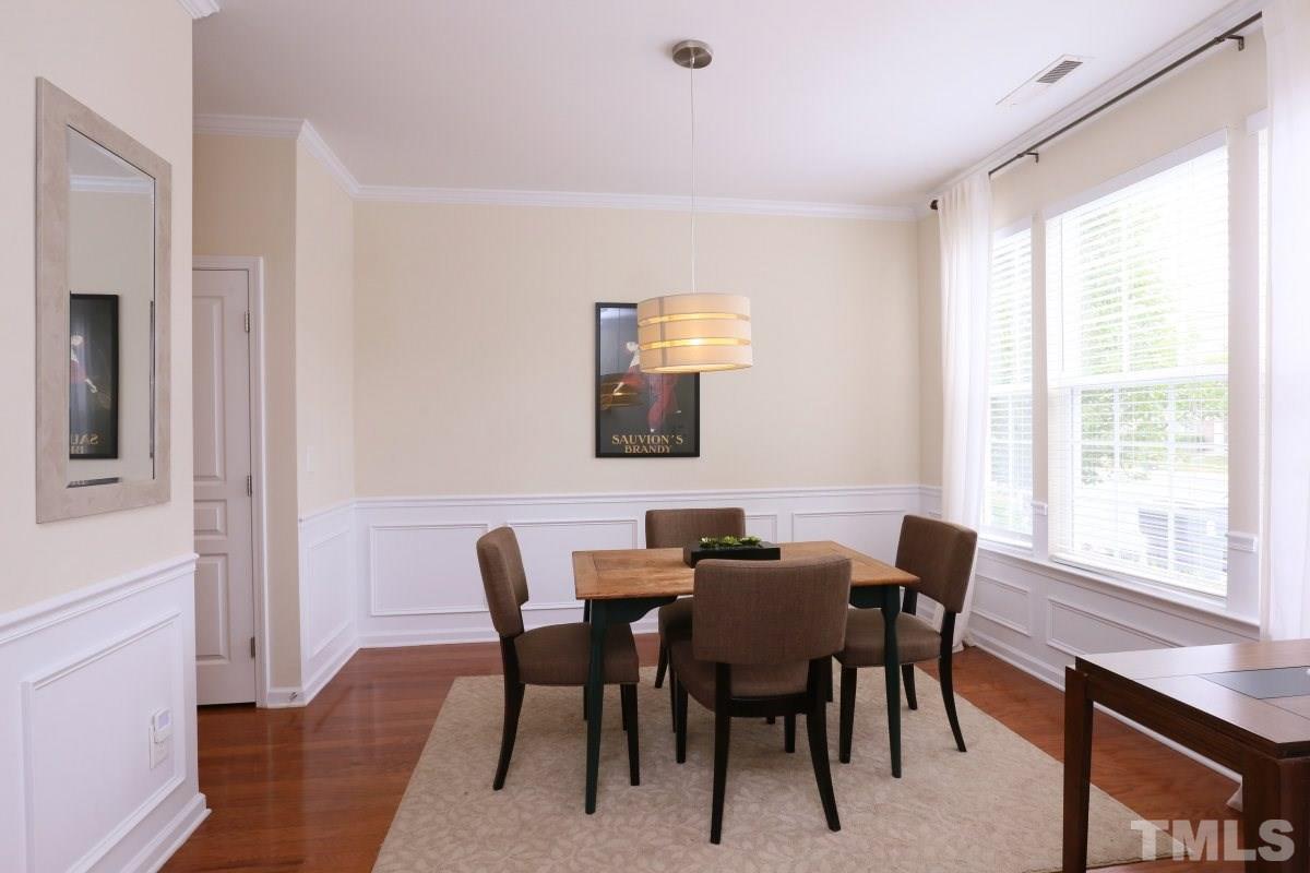 226 Cedar Elm Road Durham, NC 27713 - Photo 4 of 25 a view of a dining room with furniture and a window