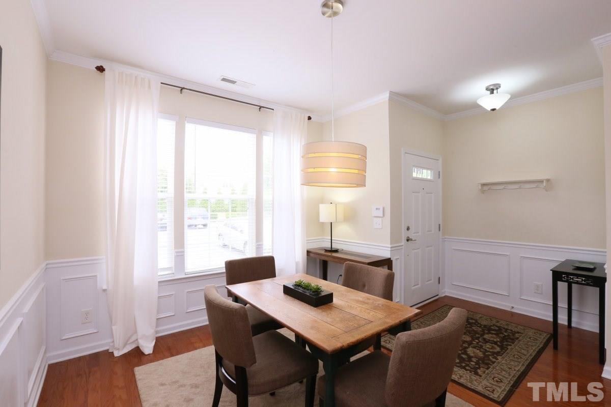 226 Cedar Elm Road Durham, NC 27713 - Photo 5 of 25 a view of a dining room with furniture window and wooden floor