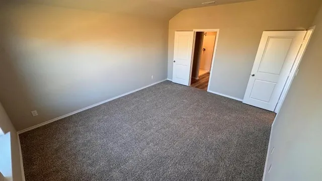 a large kitchen with sink shower and a stove