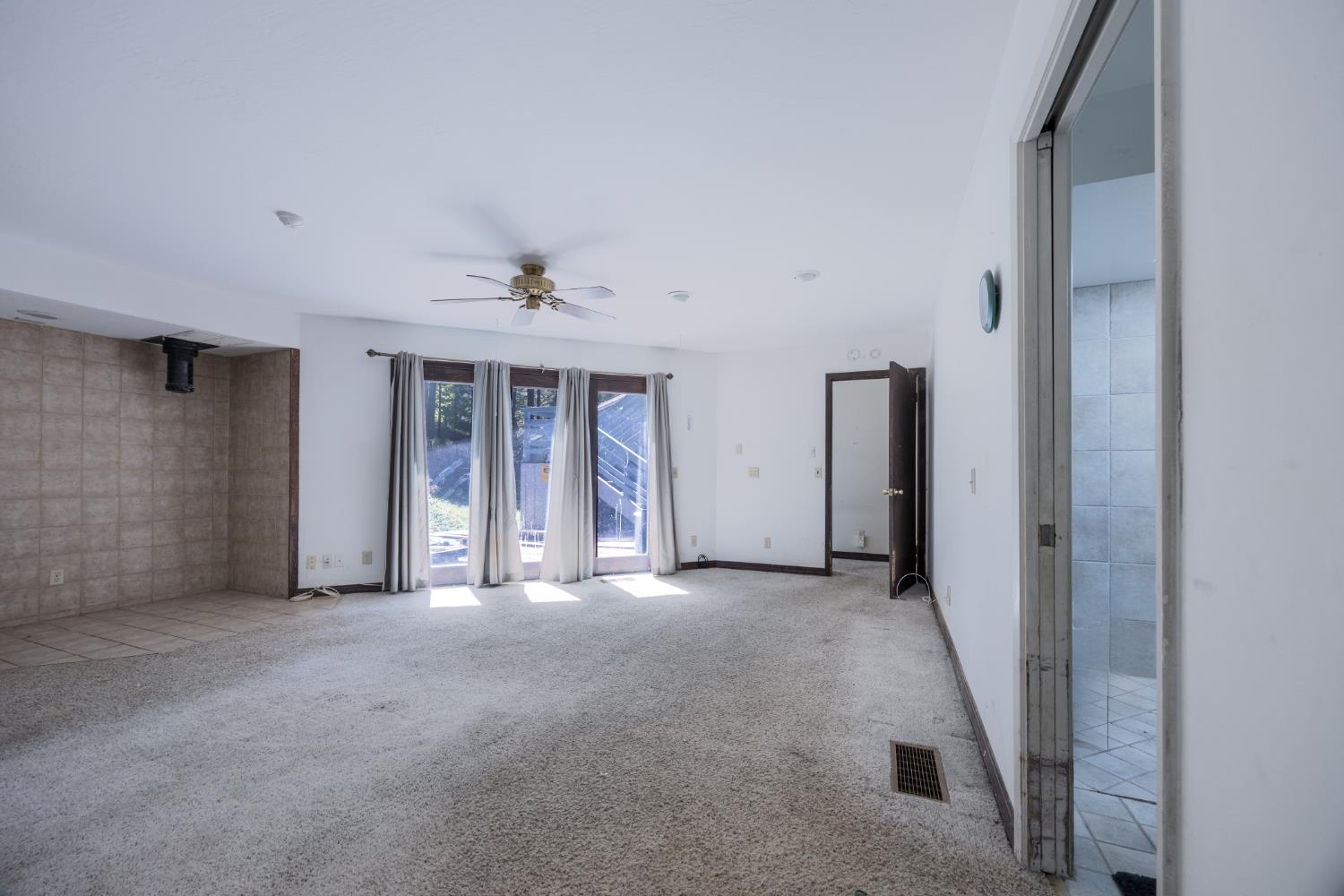 2070 King Of The Mountain Road Pollock Pines, CA 95726 - Photo 12 of 53 an empty room with windows