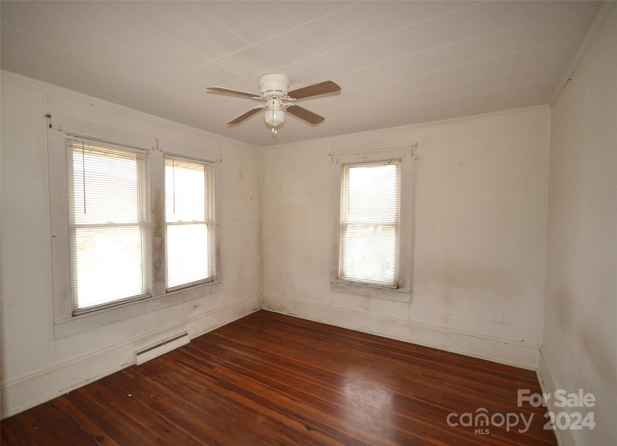 46 Murray Road Canton, NC 28716 - Photo 11 of 17 a view of empty room with wooden floor and fan