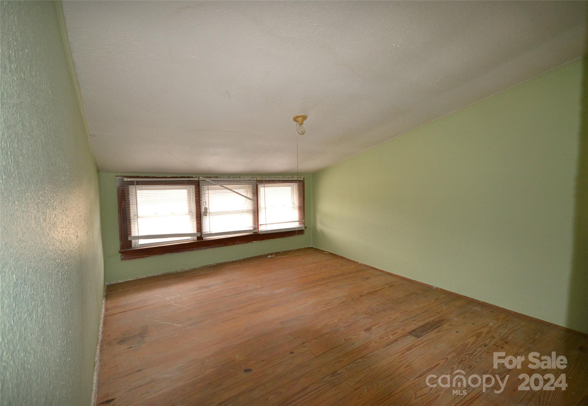 46 Murray Road Canton, NC 28716 - Photo 17 of 17 an empty room with a windows and cabinet
