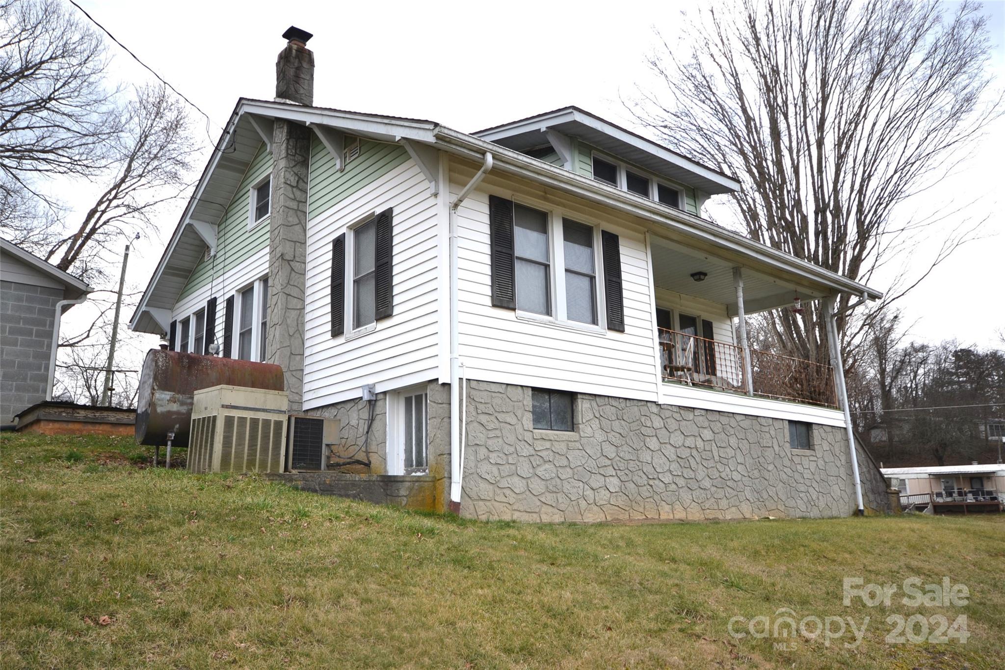 46 Murray Road Canton, NC 28716 - Photo 3 of 17 a front view of a house with a yard
