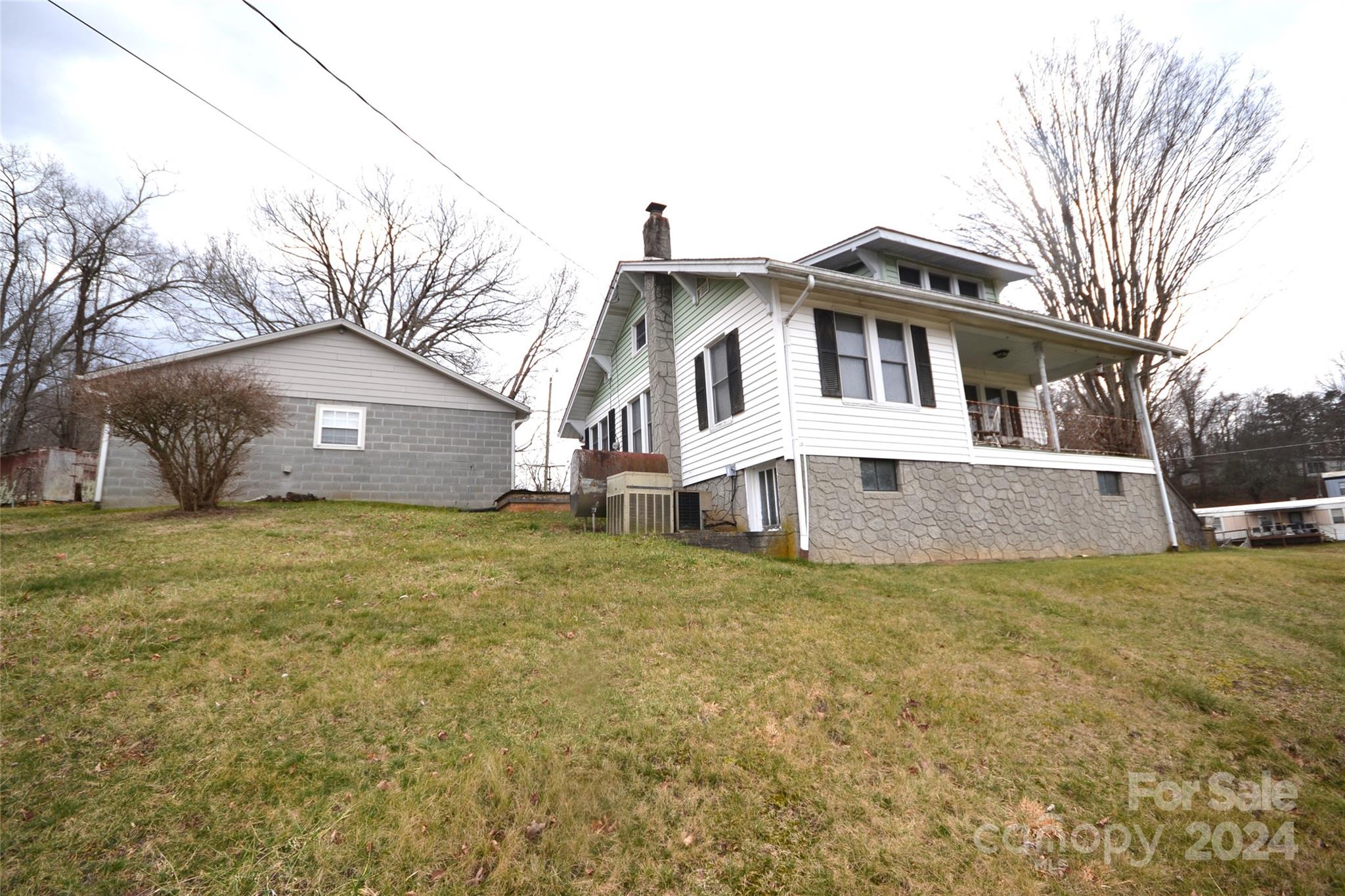 46 Murray Road Canton, NC 28716 - Photo 7 of 17 a front view of a house with a yard and garage