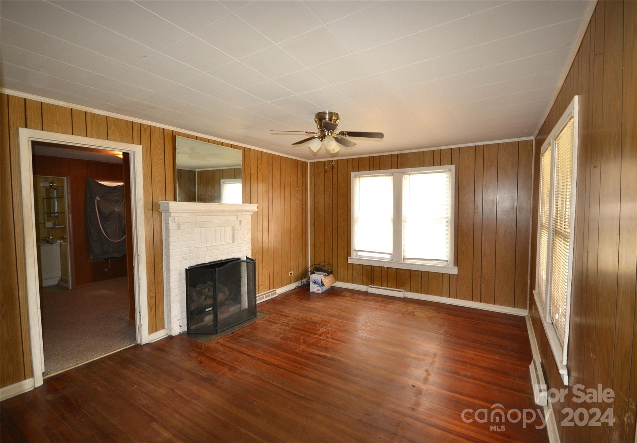 46 Murray Road Canton, NC 28716 - Photo 9 of 17 a view of an empty room with window and wooden floor
