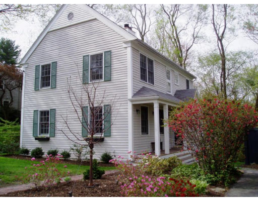 360 Woodland Road Brookline, MA 02467 - Photo 1 of 10 a front view of a house with garden