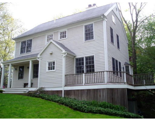 360 Woodland Road Brookline, MA 02467 - Photo 10 of 10 a front view of a house with a yard