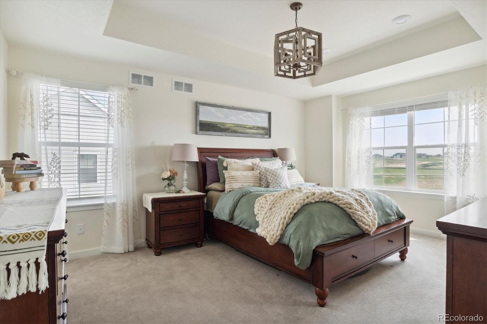 1142 Williams Loop Elizabeth, CO 80107 - Photo 20 of 38 a spacious bedroom with a bed and a window